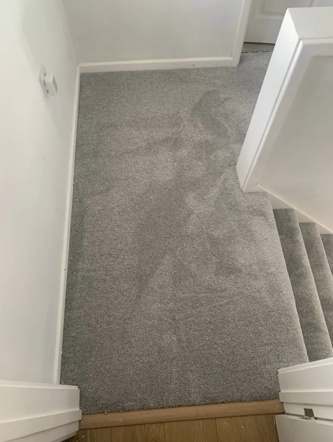 Grey carpet fitted on an upstairs landing