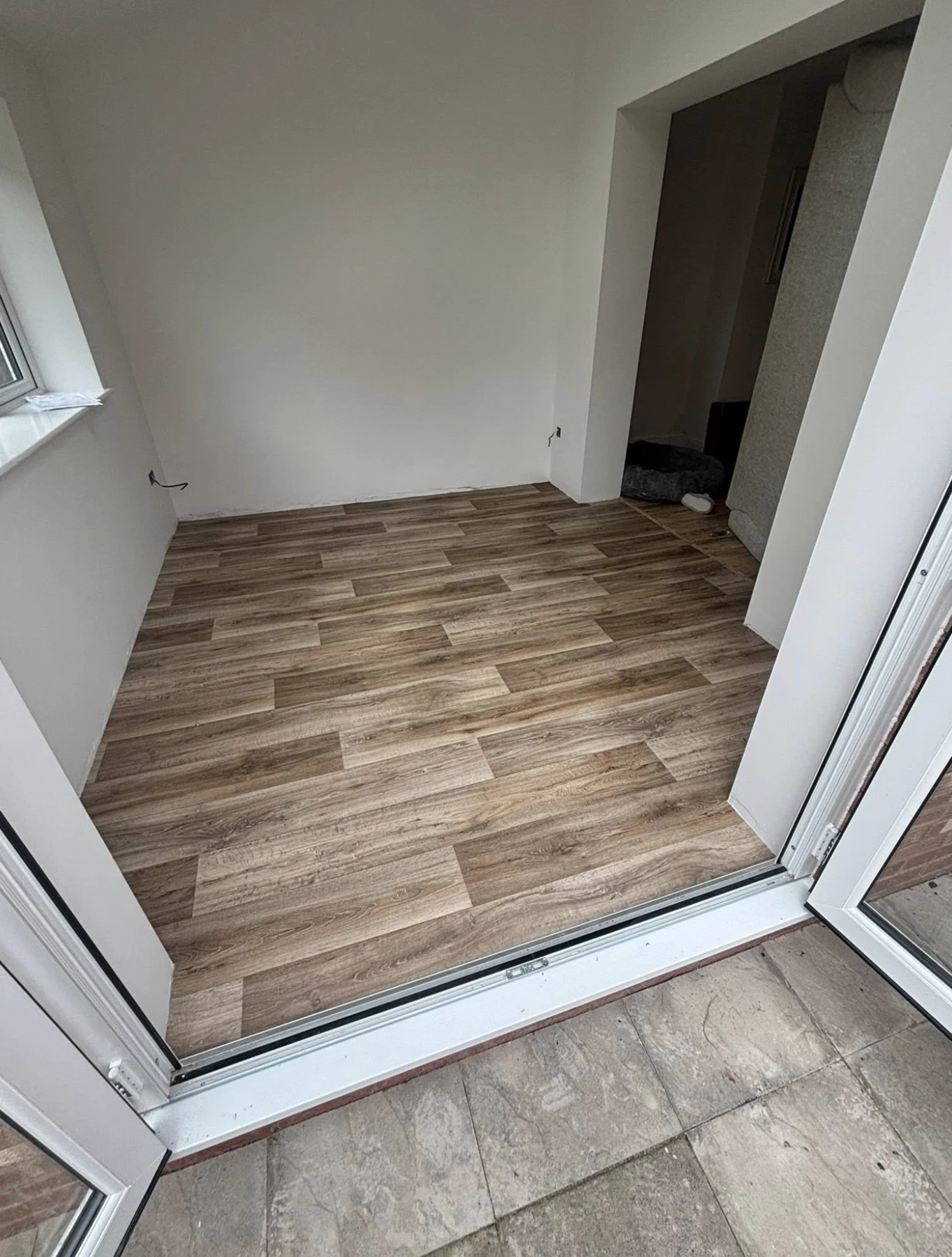 Wood-look flooring fitted in a bright home interior